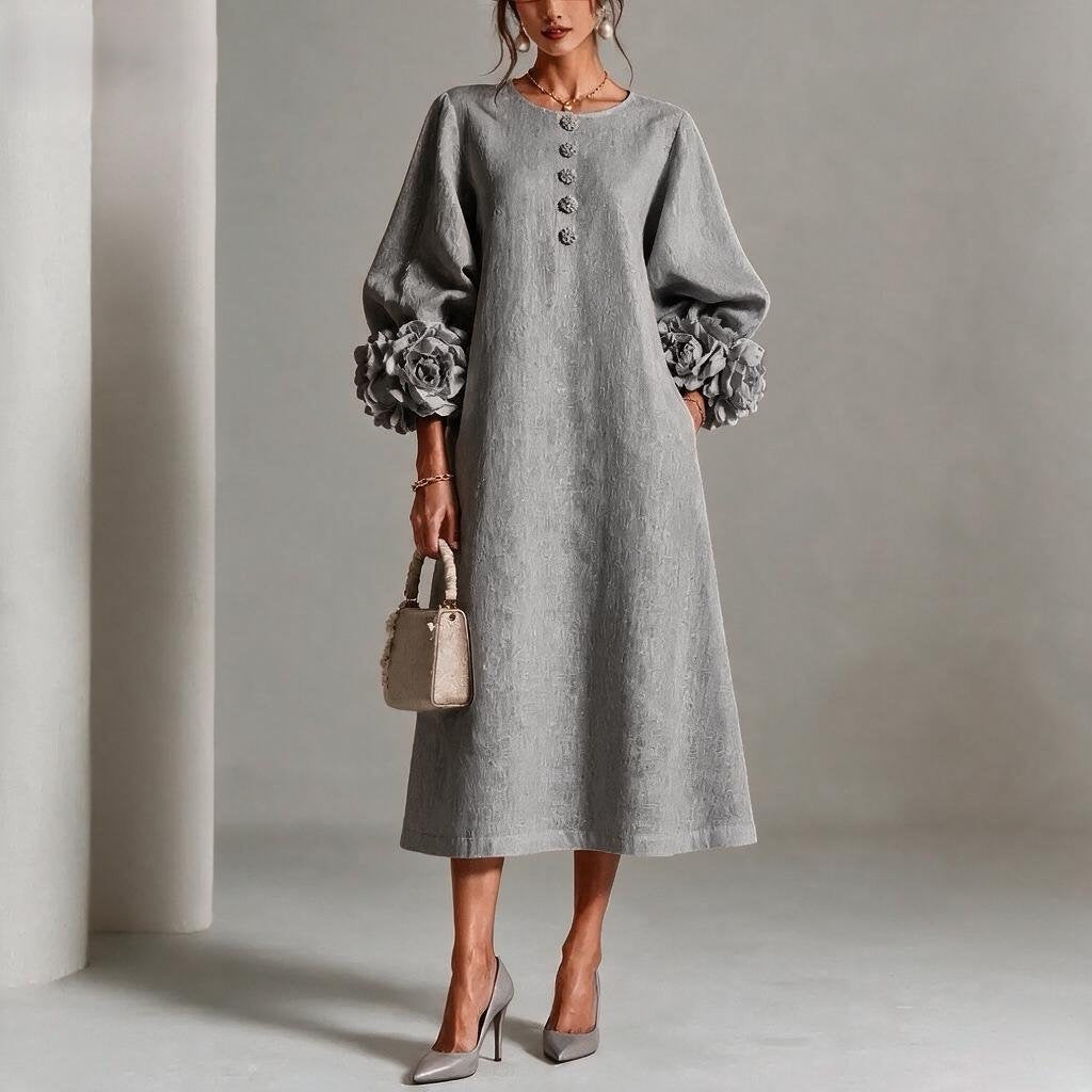 A-linjeklänning med puffärmar och blomdetaljer i fransk stil
