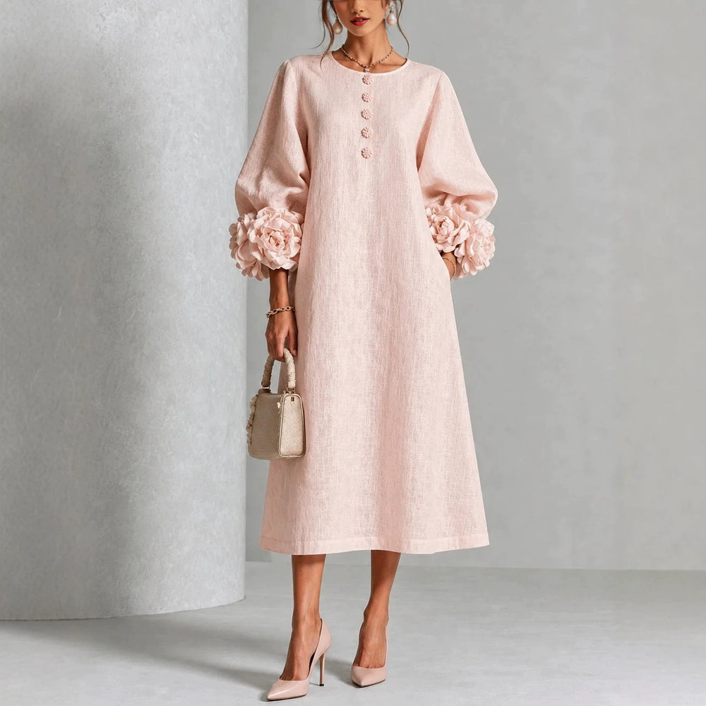 A-linjeklänning med puffärmar och blomdetaljer i fransk stil