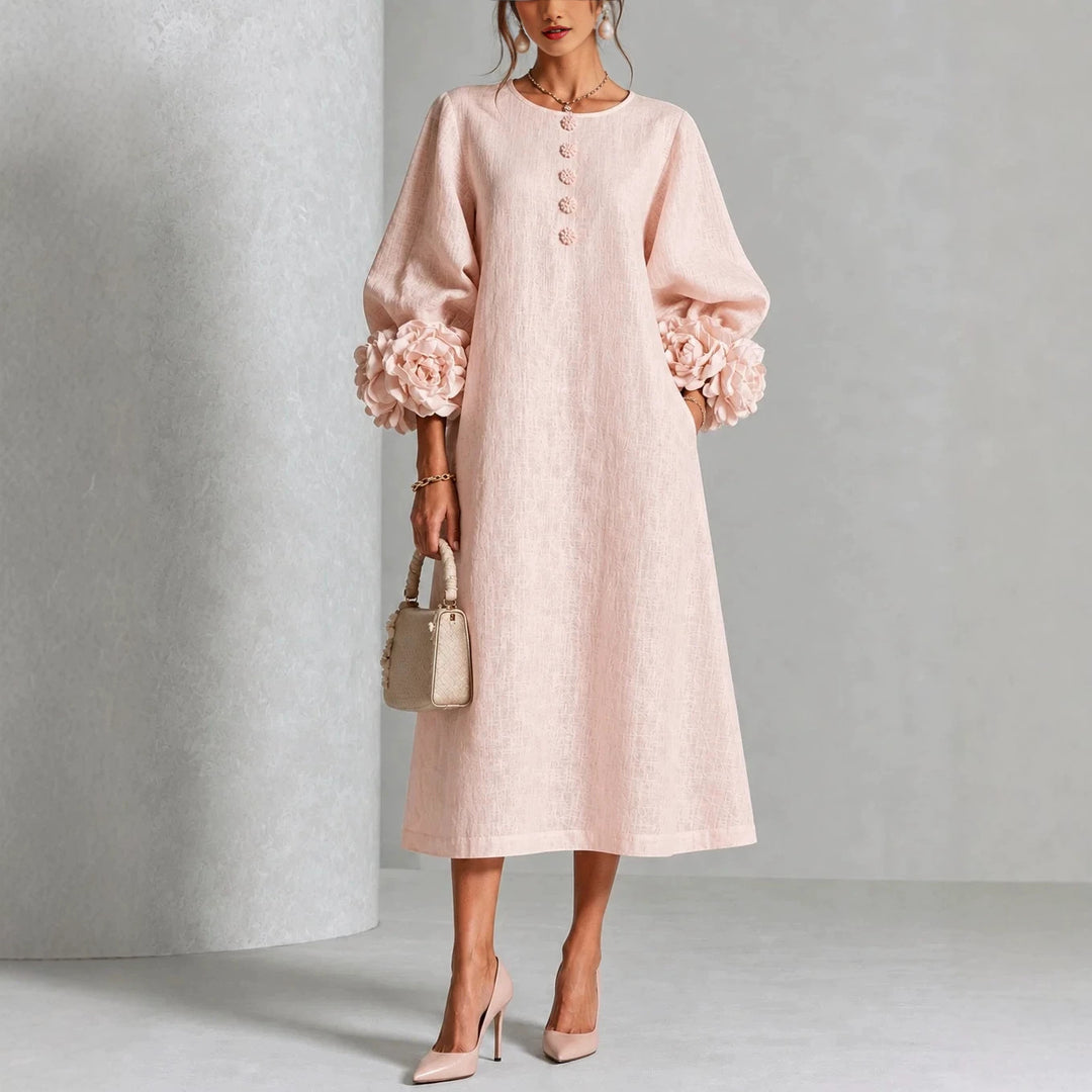 A-linjeklänning med puffärmar och blomdetaljer i fransk stil
